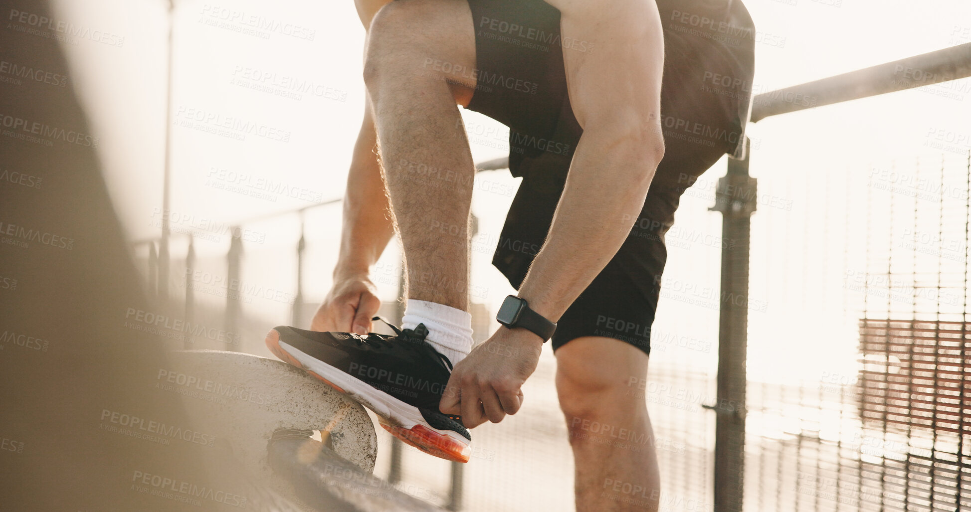 Buy stock photo Hands, shoelace and man in city, fitness for wellness and comfort for footwear, sunshine and exercise. Outdoor, athlete and person with sneakers, practice and training with challenge and start day