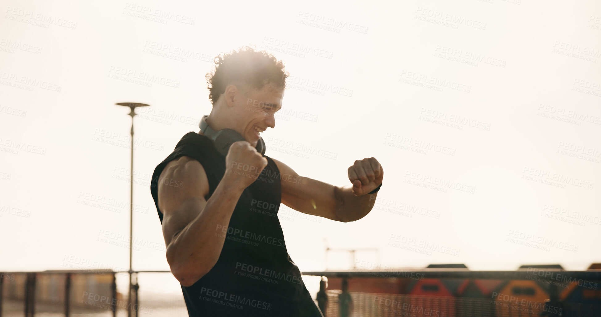 Buy stock photo Athlete, man and cheering for smart watch in city for success, exercise stats and achievement. Smile, male person and fist pump for celebration, running timer and winner of sports competition outdoor