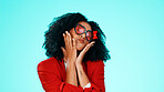 Portrait, woman and heart sunglasses with kiss in studio for fashion, accessory and aesthetic. Love expression, romance and person with confidence, eyewear and style for frames on blue background