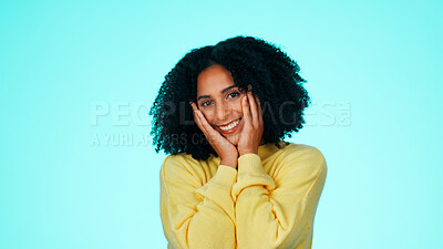 Buy stock photo Portrait, excited and woman in studio for wow, surprise and shy or flirting expression. Smile, good news and space with thank you gesture for secret, compliment and omg emoji on blue background