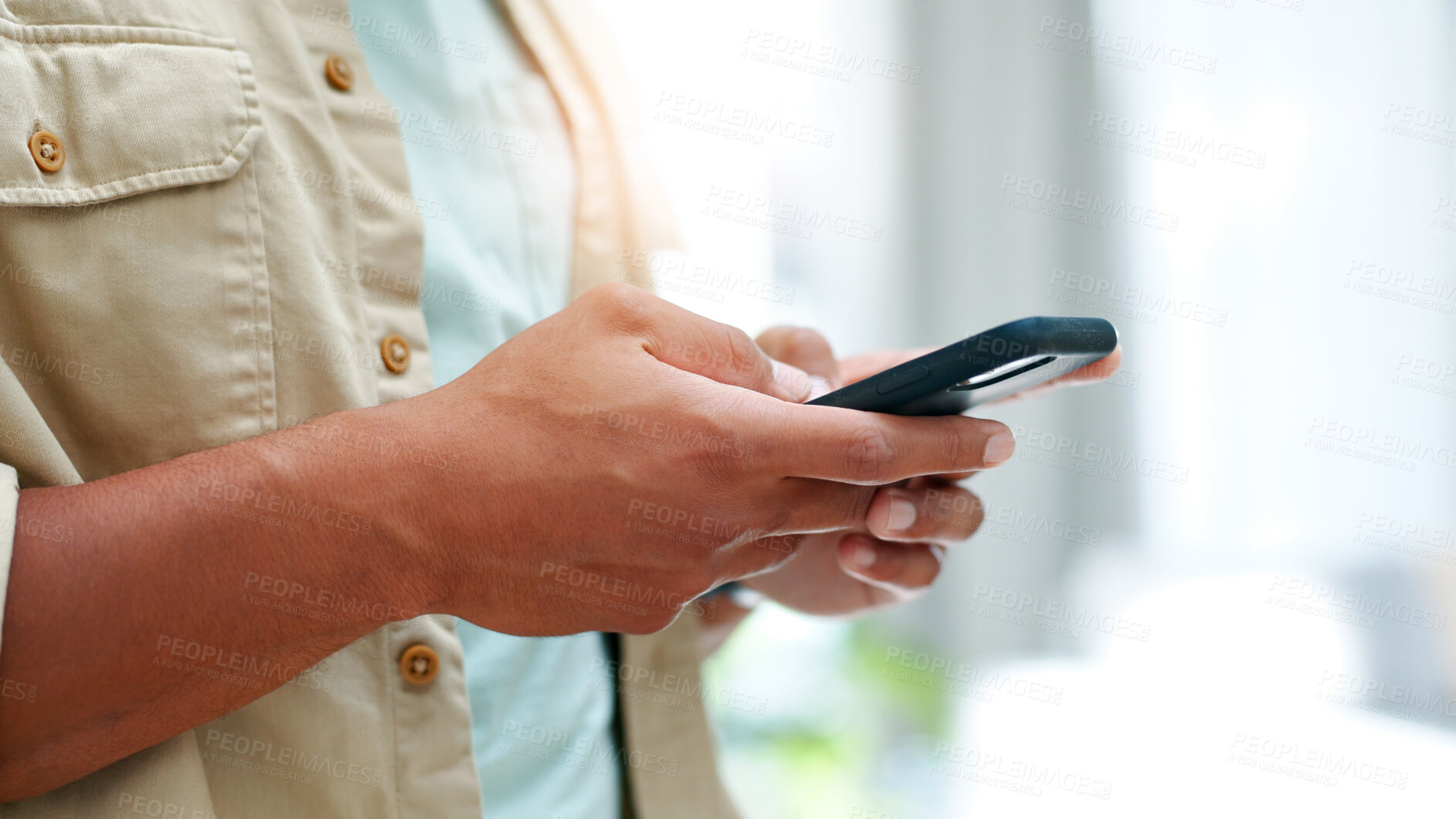 Buy stock photo Hands, phone and typing with designer person in office for communication, feedback or text message. App, digital and mobile review with employee in design workplace for social media post or update