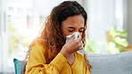 Sick, woman and blowing nose in home for allergy problem, flu and virus infection in living room. Tissue paper, disease and person on sofa with cold symptoms, bacteria or health risk in house