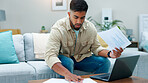 Laptop, stress or man with paperwork for remote work, fraud detection or reading report for audit. Review, worry or freelance auditor with record evaluation for accuracy, pc or incorrect data in home