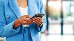 Businesswoman, hands and typing in office with phone, check website and update for financial audit. Accountant, female person and scroll in firm with tech, text message or mobile app for company news