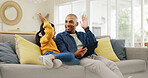 Father, child and high five on couch with tablet, playing online game and bonding together on weekend. Happy, dad and daughter in home with tech, kids app or celebration for gaming win in living room
