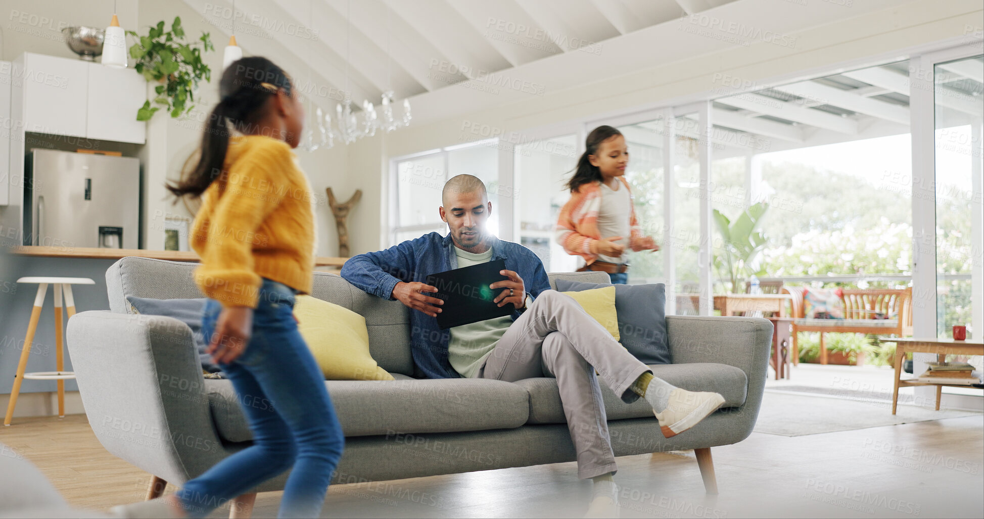 Buy stock photo Tablet, father and girls in home, running and digital app for social media, energetic or bonding together. Playing, family or dad on couch, chaos and daughters with tech for online reading and email