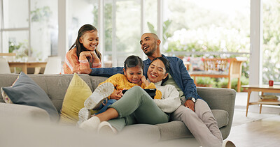 Buy stock photo Parents, children and relax on couch with tablet, playing online game and bonding together on weekend. People, family and girls in house with digital tech, kids app and gaming website for wellness.