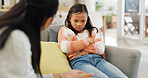 Discipline, upset and mom with child on sofa for behavior, trouble and consequences for bad attitude. Parenting, listen and mother with girl in lecture, discussion and scold for family rules in home