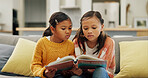 Reading book, friends and girls in lounge, relax and education for child development. Home, fantasy novel and kids on couch, storytelling and learning for growth, knowledge and hobby for imagination
