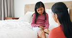 Mom, daughter and bandage in home with knee injury, first aid assistance and wound from accident. Woman, girl child and help in bedroom with plaster, bruise and healing support for hurt leg in house.