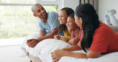 Buy stock photo Smile, parents and kids relax on bed, bonding together and laughing with care in morning at house. Children, mother and father in bedroom at home with funny joke, connection and family with sisters