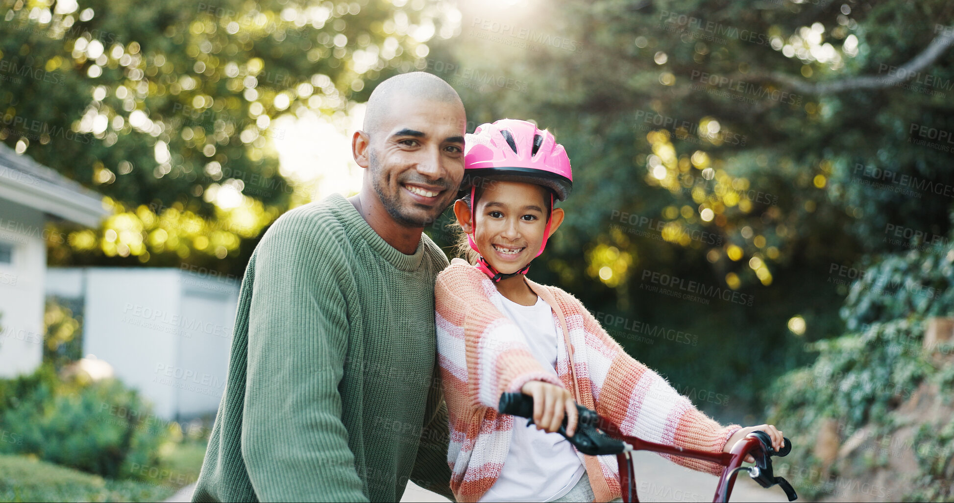 Buy stock photo Bike, portrait and father teaching daughter how to cycle or ride outdoor in front of home. Bicycle, growth and smile of girl child with happy single parent man in driveway for learning or safety