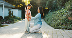 Child, mother and smile for care at backyard, connection and bonding together for learning by house. Mom, girl and happiness with kid for growth, love and teaching with parent outdoor by family home
