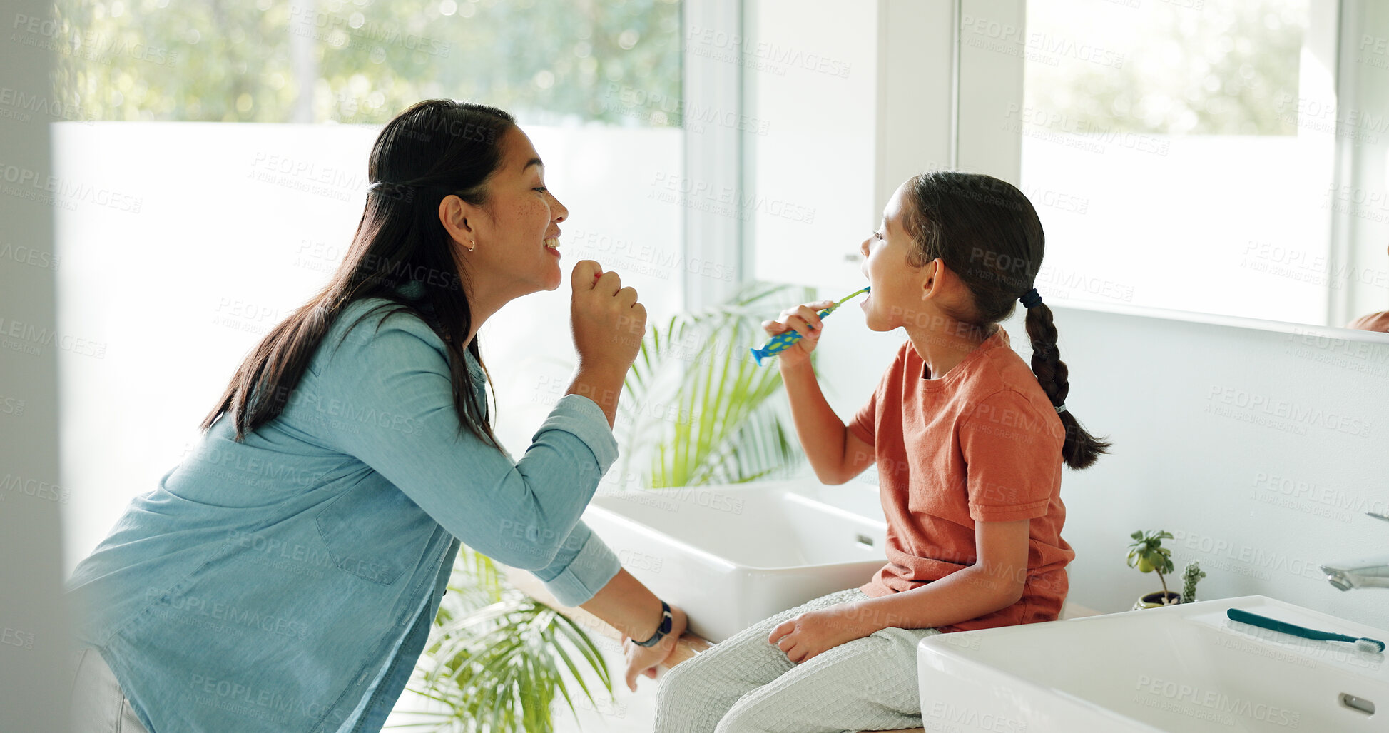 Buy stock photo Mother, girl and brushing teeth in bathroom for teaching, oral hygiene or morning routine for bonding. Learning, happy woman or child with toothbrush for dental care, cleaning mouth technique or home