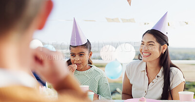 Buy stock photo Happy people, family and birthday with party hat for outdoor celebration together at table. Excited, group or laughing with smile, balloons or milestone for another year, wishes or social gathering