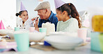 Grandfather, kids and blower for birthday in home, bonding together and care with generations. Grandparent, happy girls and horn at party with cake, special day or children at family celebration