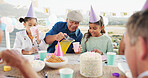 Grandfather, child or juice for birthday at patio, bonding together or care with generations. Pour drink, girl and grandparent at party for special day, celebration and happy kids with family outdoor