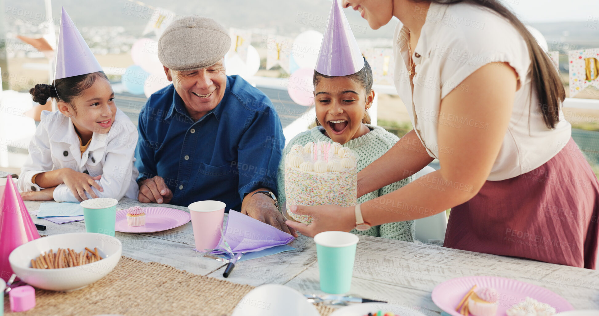 Buy stock photo Family, kid or cake for birthday surprise at patio, congratulations and shock with grandfather. Dessert, happy girl and generations at party for special day, wow and excited for celebration with mom