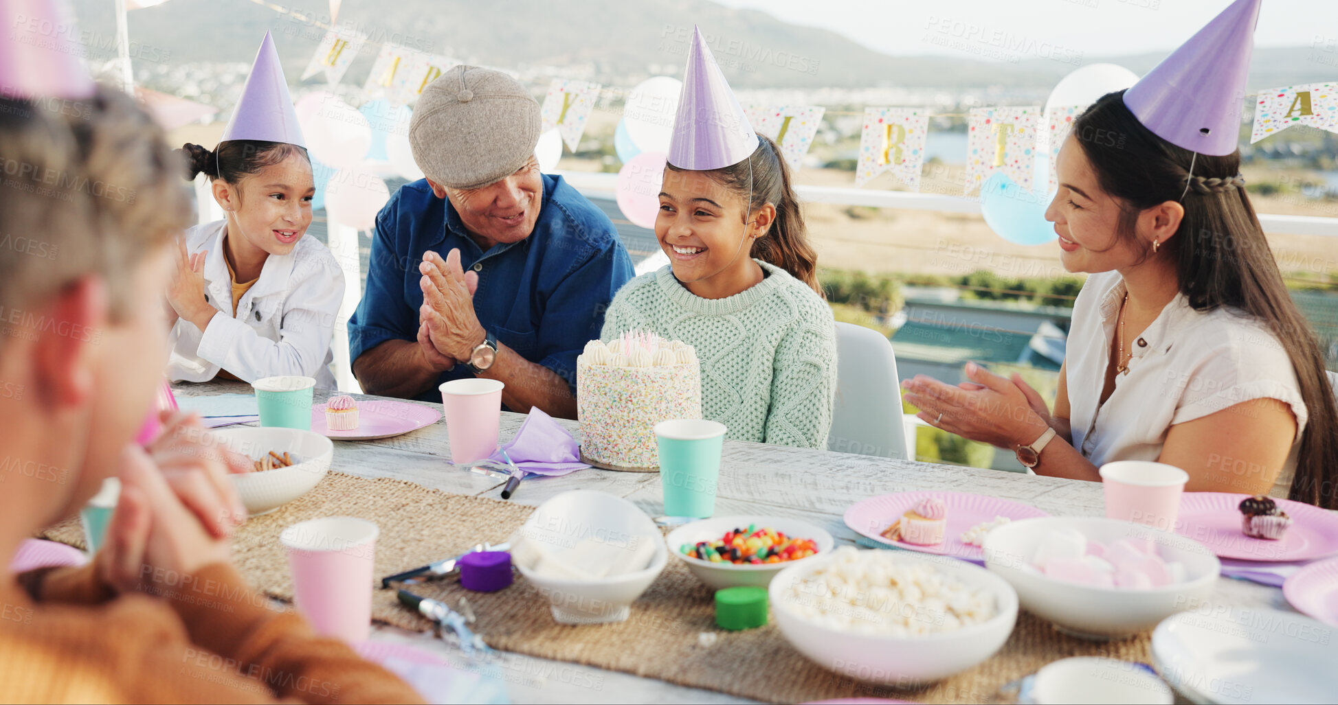 Buy stock photo Happy, family and children at birthday party with applause, cake and generations bonding for support. People, clap and mom outdoor in backyard with girls, grandfather and celebration for special day.