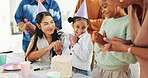 Happy child, family and applause with birthday party, cake or hat for outdoor celebration together. Excited, group or clapping with smile, dessert or milestone for year, wishing or social gathering