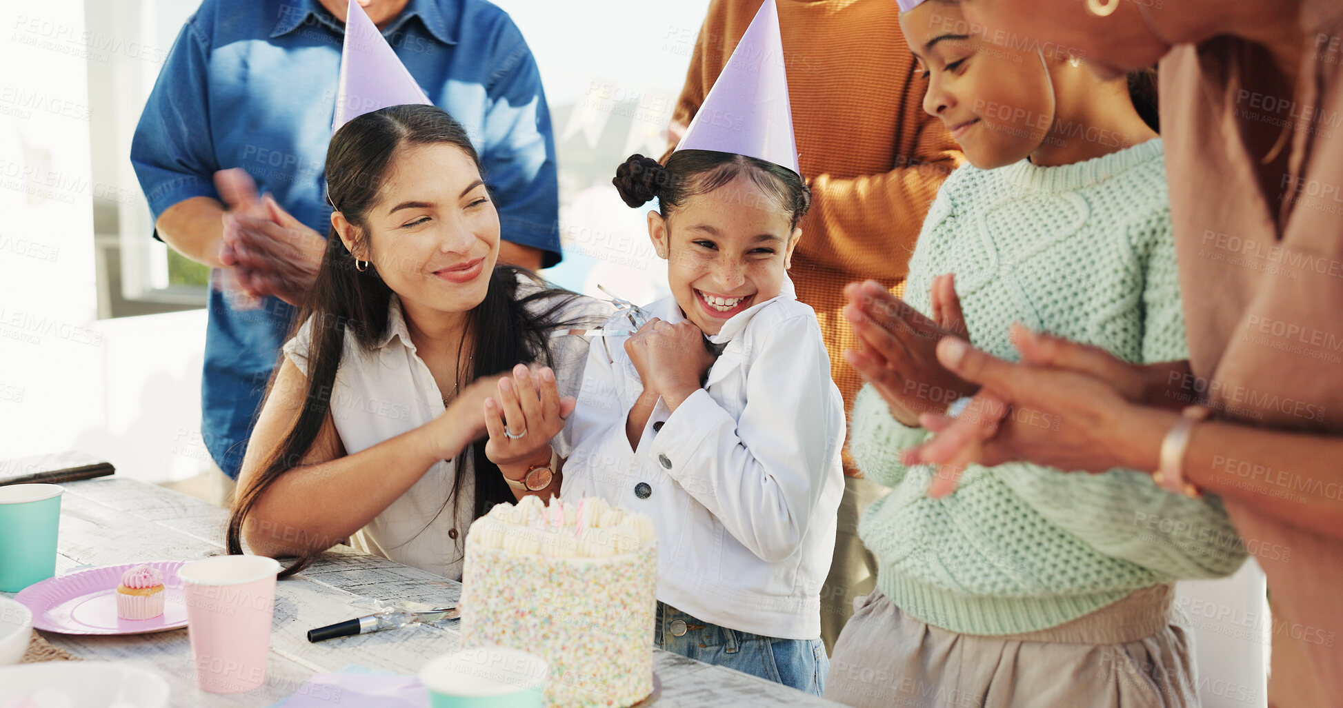 Buy stock photo Happy child, family and applause with birthday party, cake or hat for outdoor celebration together. Excited, group or clapping with smile, dessert or milestone for year, wishing or social gathering