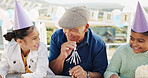 Grandfather, kid or blower for birthday at patio, bonding together or celebration with family. Horn, happy girl or grandparent at party for special day, happiness or children with generations outdoor