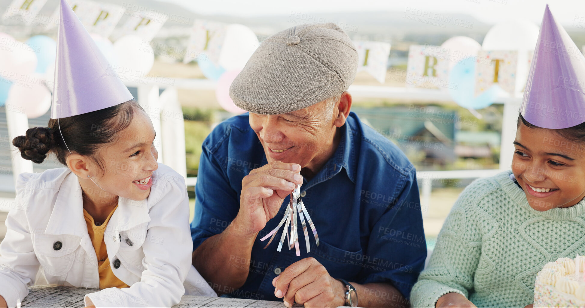 Buy stock photo Grandfather, kid or blower for birthday at patio, bonding together or celebration with family. Horn, happy girl or grandparent at party for special day, happiness or children with generations outdoor