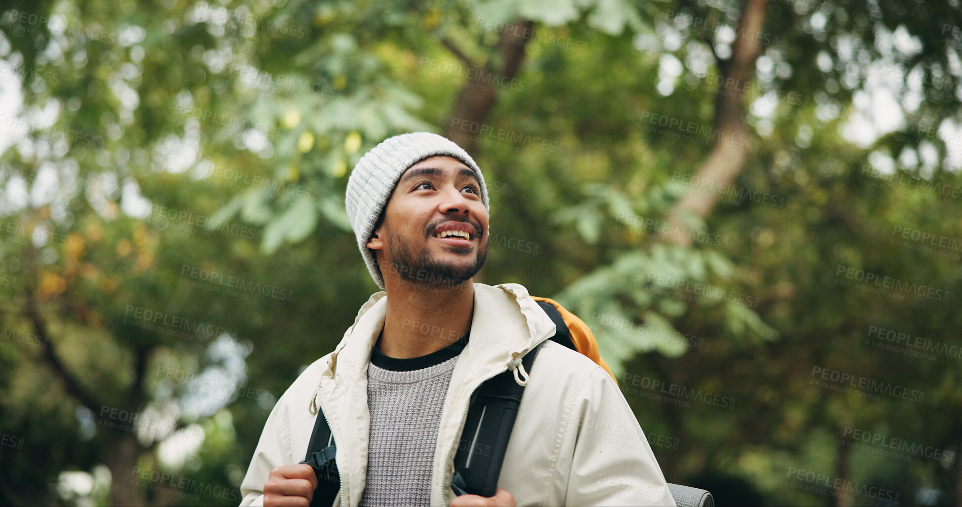 Buy stock photo Happy, thinking and hiking with man in nature for eco tourism, adventure and national park. Sustainability vacation, backpacking and trekking with person outdoor for wellness, idea and vision