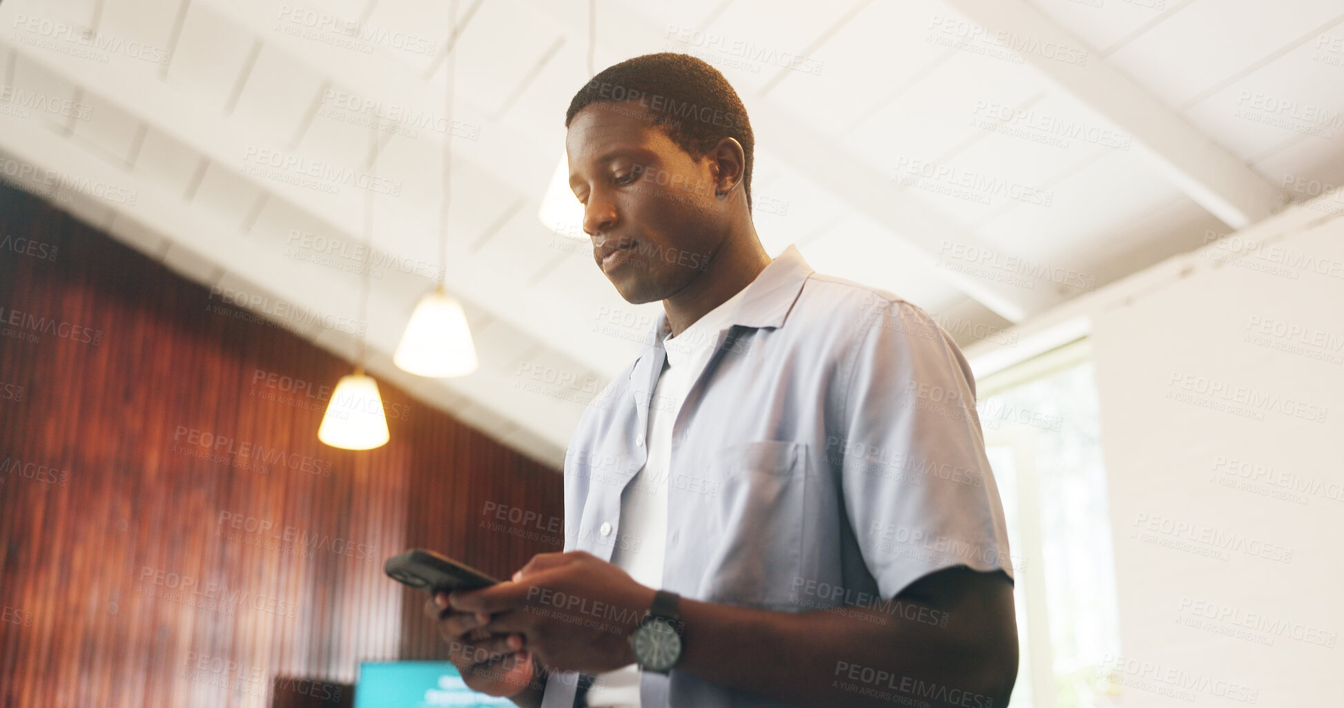 Buy stock photo Message, review or black man in office with phone, agenda change or project discussion in online chat. Reading, digital or employee in agency with tech, meeting schedule and feedback on report update