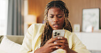 Confused, error and phone with black woman on sofa in home for communication, mistake and scam. Contact, online glitch and phishing link with person and mobile in living room of apartment for app