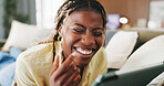 Surprise, smile and black woman in home, tablet for social media and funny reaction for post. Apartment, tech and African person on couch, connection for online humor and laughing for joke and text
