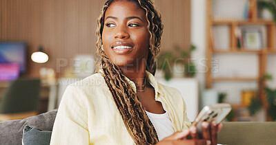 Buy stock photo Relax, thinking and phone with black woman on sofa in home for communication, social media and smile. Contact, online chat and reflection with person and mobile in living room of apartment for app