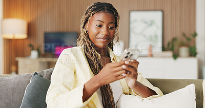 Buy stock photo Happy, reading and phone with black woman on sofa in home for communication, social media and smile. Contact, online chat and connection with person and mobile in living room of apartment for app