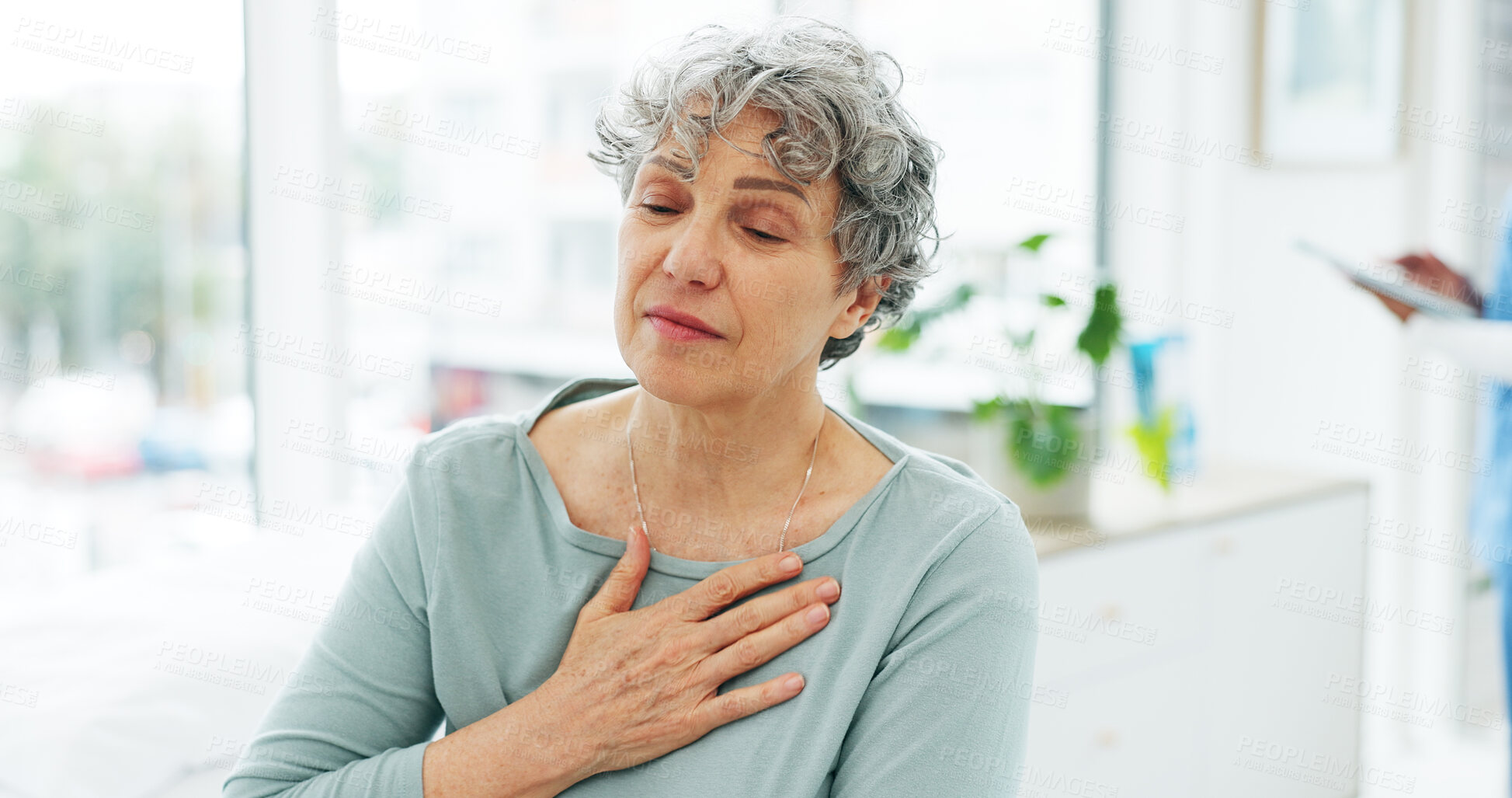 Buy stock photo Consultation, medical and senior woman with chest pain or cardiovascular emergency in hospital. Diagnosis, lung infection and elderly patient in clinic for healthcare, heart attack or illness.