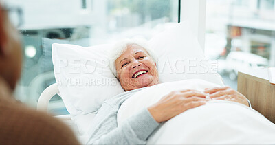 Buy stock photo Smile, senior woman and visit in hospital bed for emotional support, bonding or medical recovery. Happy, elderly couple or checkup on patient, partner compassion and healing from healthcare operation