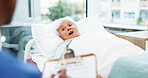 Doctor, patient and old woman in hospital bed, clipboard for symptoms or conversation. Pensioner, medical service or mature person in clinic, discussion for diagnosis or documents for healthcare info