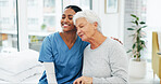 Smile, hug and nurse with senior woman in hospital for conversation, comfort or support at checkup. Happy, trust and medical caregiver with elderly female patient embracing at healthcare consultation