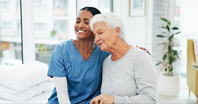 Buy stock photo Smile, hug and nurse with senior woman in hospital for conversation, comfort or support at checkup. Happy, trust and medical caregiver with elderly female patient embracing at healthcare consultation