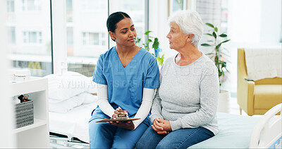Buy stock photo Clinic, woman and nurse with paperwork for health insurance, assessment or exam on bed. Clipboard, questions and senior person with caregiver in consultation for medical advice, test and support