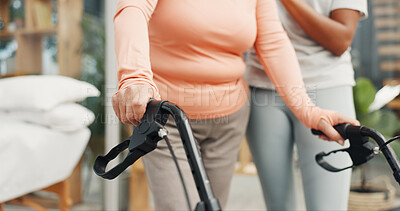 Buy stock photo Hands, walker and help for physiotherapy with support for steps, recovery or balance in retirement. Senior person with disability, rehabilitation and mobility with walking frame at wellness clinic
