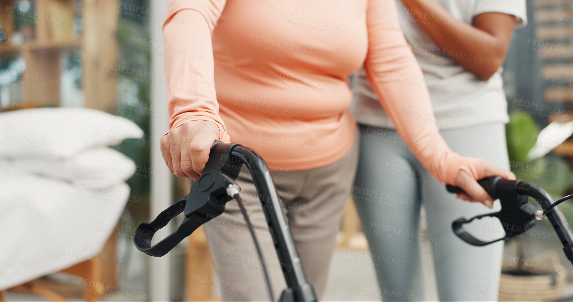 Buy stock photo Hands, walker and help for physiotherapy with support for steps, recovery or balance in retirement. Senior person with disability, rehabilitation and mobility with walking frame at wellness clinic