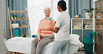 Clinic, dumbbells and old woman with exercise in physio for rehabilitation, bone strength or guidance. Health, expert and senior patient with weights for functional mobility, muscle recovery and help
