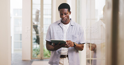 Buy stock photo Review, journalism or black man in office with tablet, draft edit or source feedback for article update. Serious, creative or copywriter with tech, proofreading or industry research for publication.