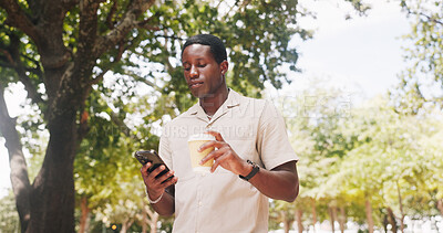 Buy stock photo Black man, phone and walk at park with coffee, texting or check notification with web chat in summer. African person, typing and outdoor with mobile app, beverage or drink with social media in nature