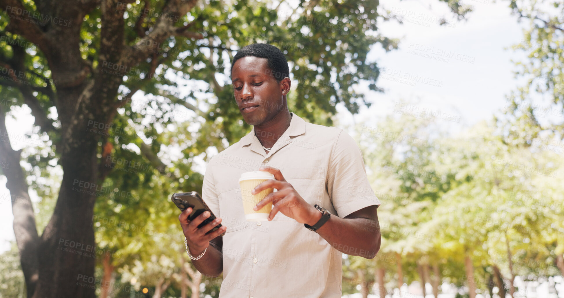 Buy stock photo Black man, phone and walk at park with coffee, texting or check notification with web chat in summer. African person, typing and outdoor with mobile app, beverage or drink with social media in nature