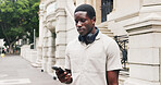 Phone, outdoor and black man in city with contact, email or communication for university application. Cellphone, reading and African male student on mobile app for online college results in town.