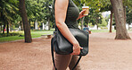 Bag, commute and hands of woman in park for coffee, morning trip or start of business. Drink, travel and walking with employee person outdoor in nature for route to work or professional opportunity