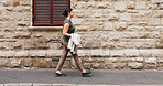 Businesswoman, walk and commute in city with job opportunity, idea and property listing for real estate. Space, person and realtor journey in town with rustic architecture, vision and travel to work.