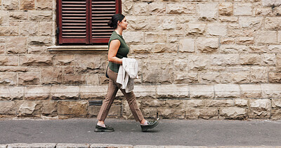 Buy stock photo Businesswoman, walk and commute in city with job opportunity, idea and property listing for real estate. Space, person and realtor journey in town with rustic architecture, vision and travel to work.