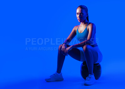 Buy stock photo Woman, exercise and medicine ball in studio with portrait, serious and mockup space on purple background. Person, balance and training with pride, fitness or muscle development for wellness in Mexico